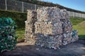 Modern waste sorting and recycling plant. Bales of dairy and drink bottles garbage in recycling plant yard prepared for shipment Royalty Free Stock Photo