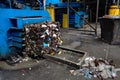 Modern waste sorting and recycling plant, hydraulic press makes Royalty Free Stock Photo