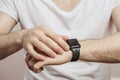 Modern watch on wrist isolated on a white background