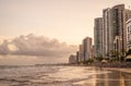 Modern waterfront buildings and beach at high tide in Recife, Brazil Royalty Free Stock Photo