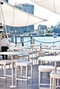 Modern waterside patio area or restaurant in a city