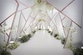 modern wedding decoration symmetrical tunnel white accent indoors