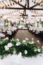 Modern wedding venue decorated with flowers and lights for a stylish boho wedding, vertical Royalty Free Stock Photo