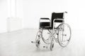 Modern wheelchair in empty room. Medical equipment Royalty Free Stock Photo