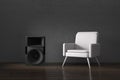 Modern white armchair and a woofer speaker in a dark moody interior room. Enjoying listening to music