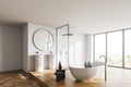 Modern white bathroom corner with sink and tub Royalty Free Stock Photo