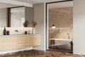 Modern white bathroom corner with tub and double sink Royalty Free Stock Photo