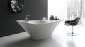 Modern white bathtub in sleek minimalist bathroom with winter view Royalty Free Stock Photo