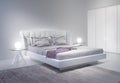 Modern white bedroom interior with violet accents Royalty Free Stock Photo