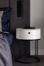 Modern white bedside table, close-up Royalty Free Stock Photo