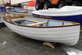 Modern white boat with oars stowed along the side Royalty Free Stock Photo