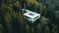 a modern white building nestled amidst a serene coniferous forest.