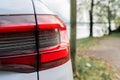 Modern white car xenon lamp headlight, back view close up. Modern car closeup of headlight Royalty Free Stock Photo