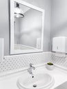 Modern white clean bathroom with big mirror and sink, luxury home interior Royalty Free Stock Photo