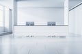 Modern white concrete office lobby interior with reception desk and computer, window with city view and daylight. Waiting area Royalty Free Stock Photo