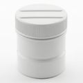 Modern white container with ridged lid and threaded base for storage or dispensing Royalty Free Stock Photo
