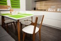 Modern white contemporary kitchen interior. Stylish dining table and chairs. Royalty Free Stock Photo