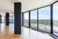 Modern white empty loft apartment interior with parquet floor and panoramic windows, Overlooking the metropolis city Royalty Free Stock Photo