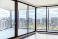 Modern white empty loft apartment interior with parquet floor and panoramic windows, Overlooking the metropolis city Royalty Free Stock Photo