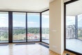 Modern white empty loft apartment interior with parquet floor and panoramic windows, Overlooking the metropolis city Royalty Free Stock Photo