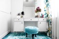 white, feminine dressing room with minimalist vanity table and mirror Royalty Free Stock Photo