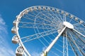 Modern white ferris wheel against blue sky Royalty Free Stock Photo