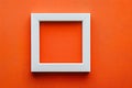 Modern White Frame on Vibrant Orange Textured Wall Blank Template Royalty Free Stock Photo