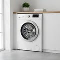 Modern White Front- Loading Washing Machine in a Laundry Room Setting appliance home Royalty Free Stock Photo