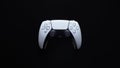 Modern white gamepad isolated on a black background Royalty Free Stock Photo