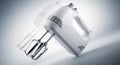 Modern white handheld electric mixer with whisk attachments for kitchen baking and cooking Royalty Free Stock Photo