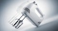 Modern white handheld electric mixer with whisk attachments for kitchen baking and cooking Royalty Free Stock Photo