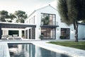 Modern white house with swimming pool and a tree real estate