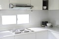 Modern white kitchen with counter and white details, minimalist interior