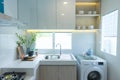 Modern white kitchen with counter and white details, minimalist interior