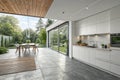 Modern white kitchen and dining room with nature view Royalty Free Stock Photo