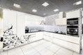Modern white kitchen furniture. Painted front surface. The material used in the manufacture - MDF Royalty Free Stock Photo