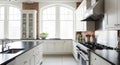 Modern White Kitchen with Island and Large Arched Windows interior home Royalty Free Stock Photo