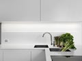 Modern white kitchen with vegetables Royalty Free Stock Photo