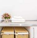 Modern white laundry room with two baskets