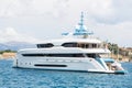 Modern white mega yacht in the blue sea. Rich people on holidays.