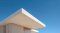 Modern white minimalistic building corner with clean lines and sharp angles under clear blue sky showcasing architectural Royalty Free Stock Photo