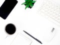 Modern white office desk table with keyboard computer, coffee, smart phone and other office supplies of necessity, Top view with Royalty Free Stock Photo