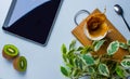 Modern white office desk table with laptop, cup of coffee. Royalty Free Stock Photo