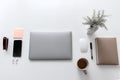 Modern white office desk table with laptop, smartphone and other supplies . Royalty Free Stock Photo