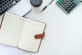 Modern White office desk table with pen, leather notebook,calculator,laptop and cup of coffee Royalty Free Stock Photo