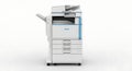 Modern white office multifunction printer with paper trays Royalty Free Stock Photo