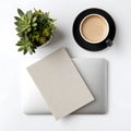 Modern White Office Workspace Setup with Laptop and Coffee Royalty Free Stock Photo