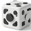 Modern white puzzle cube with unique magnetic connectors on each face Royalty Free Stock Photo