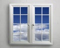 Modern white pvc window with view of blue sky