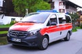 Modern white, Red ambulance emergency service vehicle, medics provide assistance, concept of emergency medical care, patient